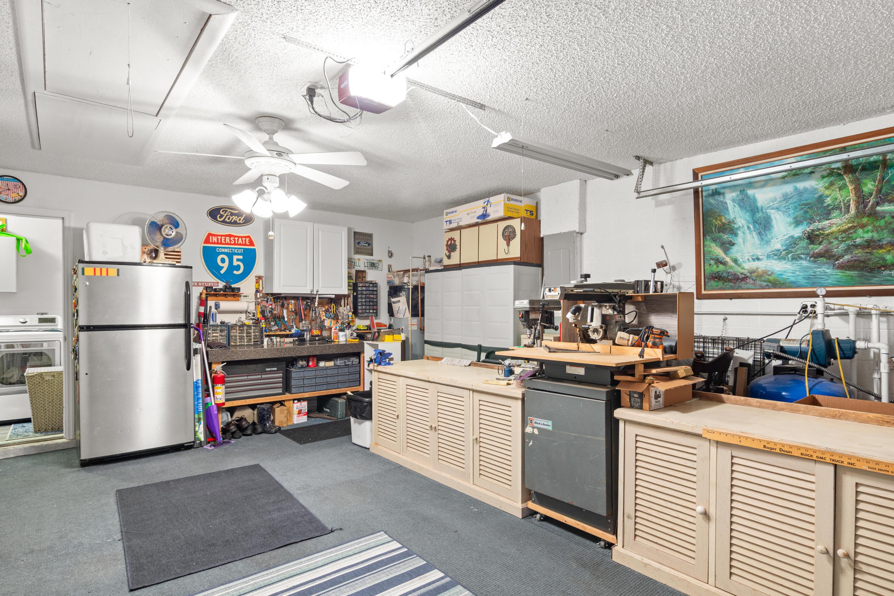 1817 Southwest Davis Street Port St. Lucie, FL 34953 - Photo 30 of 52 a kitchen with stainless steel appliances a stove a refrigerator and a view of living room