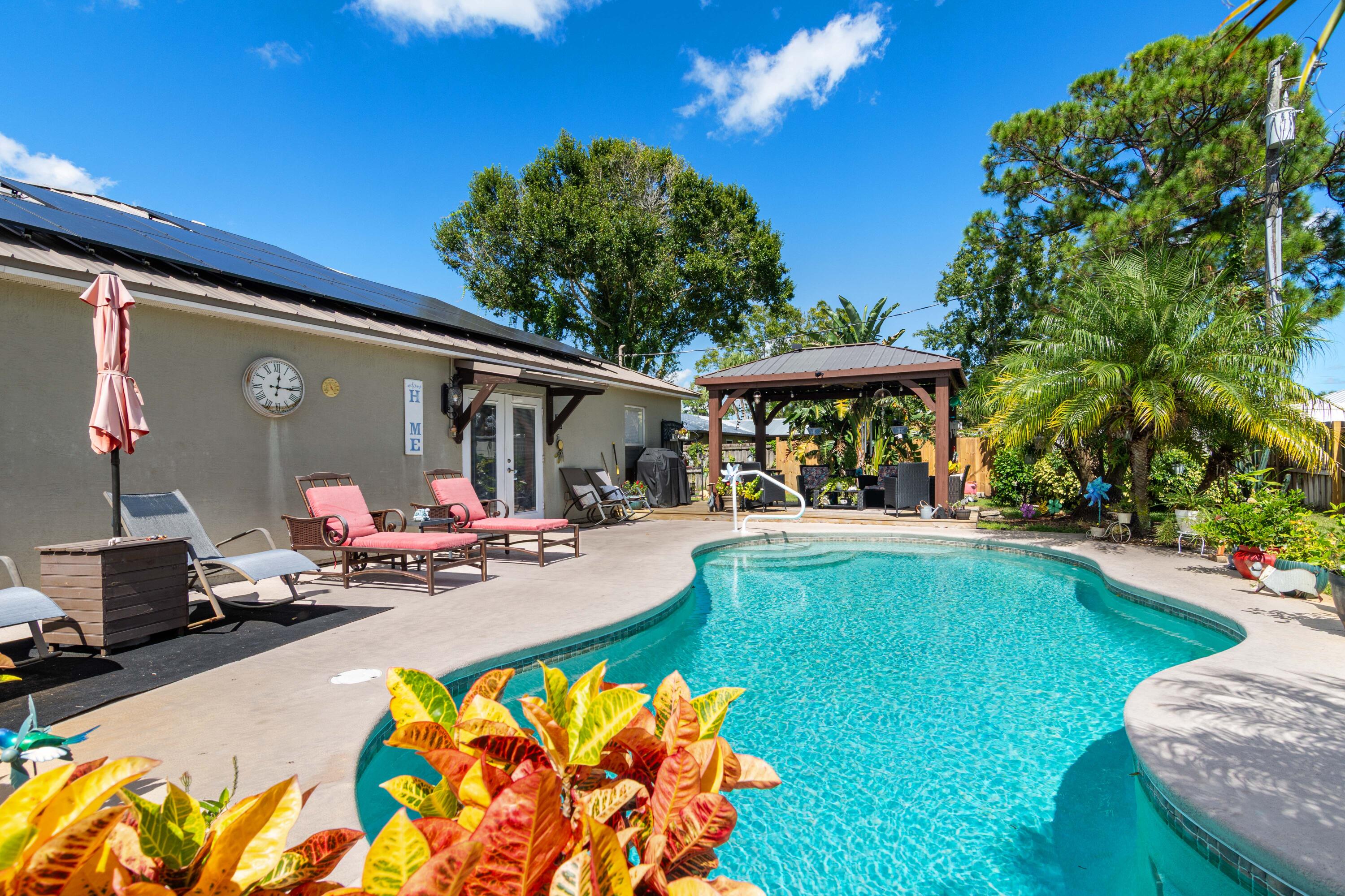 1817 Southwest Davis Street Port St. Lucie, FL 34953 - Photo 34 of 52 a view of a swimming pool with a patio