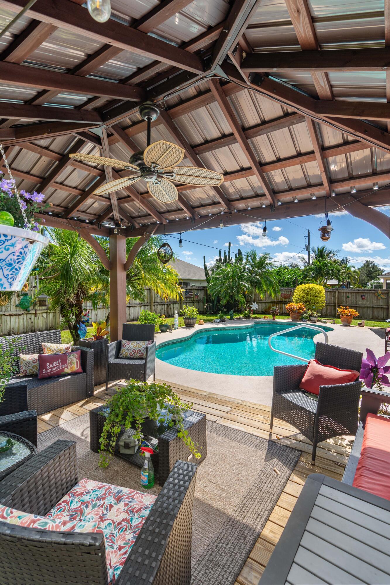 1817 Southwest Davis Street Port St. Lucie, FL 34953 - Photo 38 of 52 a view of a chairs and tables in the patio