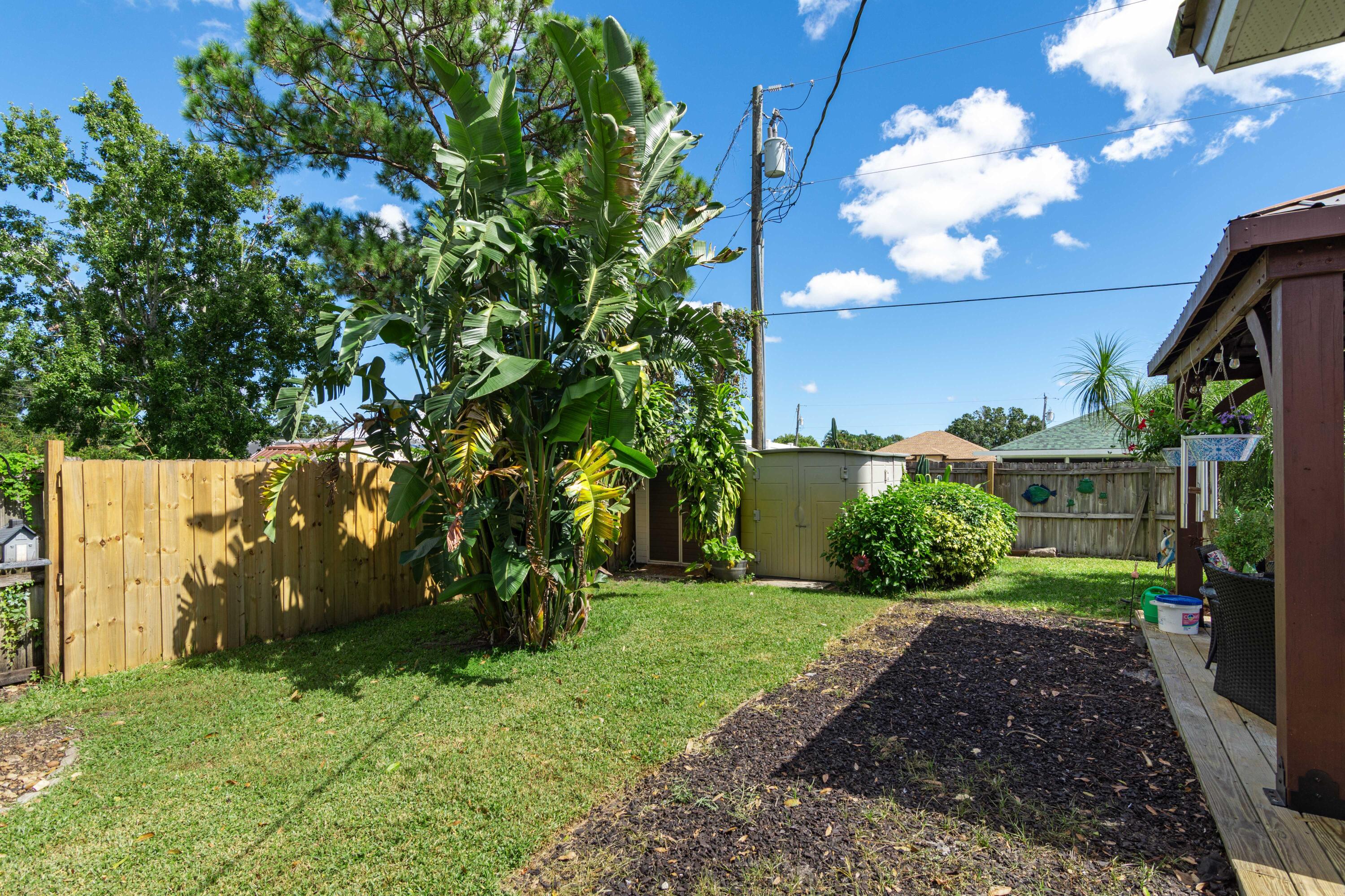 1817 Southwest Davis Street Port St. Lucie, FL 34953 - Photo 40 of 52 a view of a house with a yard