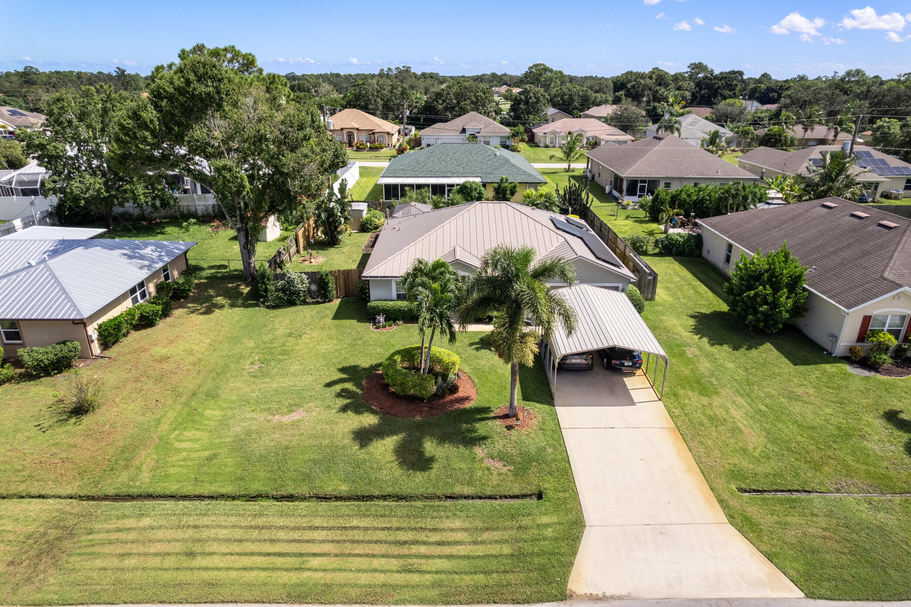 1817 Southwest Davis Street Port St. Lucie, FL 34953 - Photo 41 of 52 an aerial view of residential houses with outdoor space