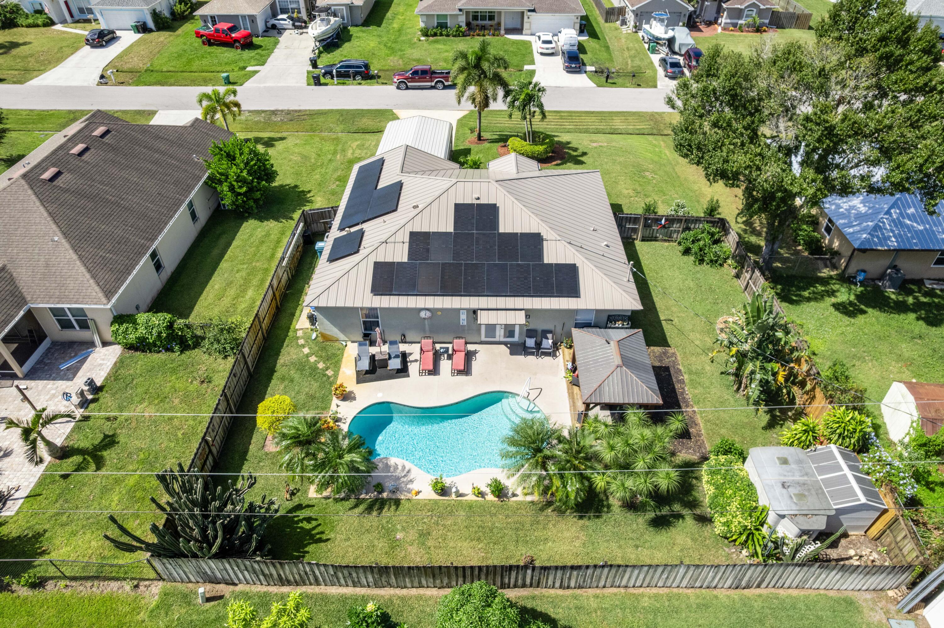 1817 Southwest Davis Street Port St. Lucie, FL 34953 - Photo 43 of 52 an aerial view of a house with yard swimming pool and outdoor seating
