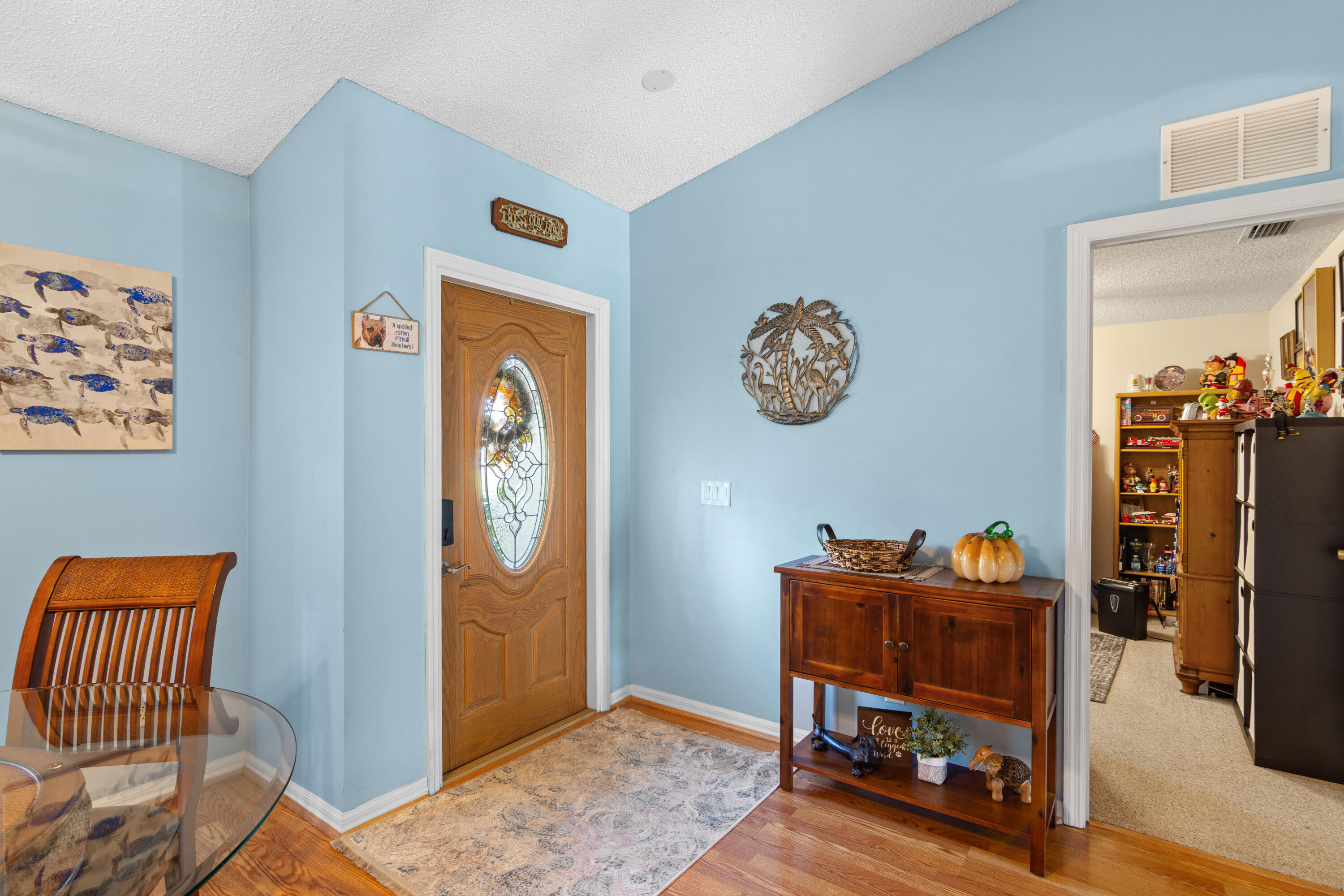 1817 Southwest Davis Street Port St. Lucie, FL 34953 - Photo 7 of 52 a view of a workspace with furniture and wooden floor