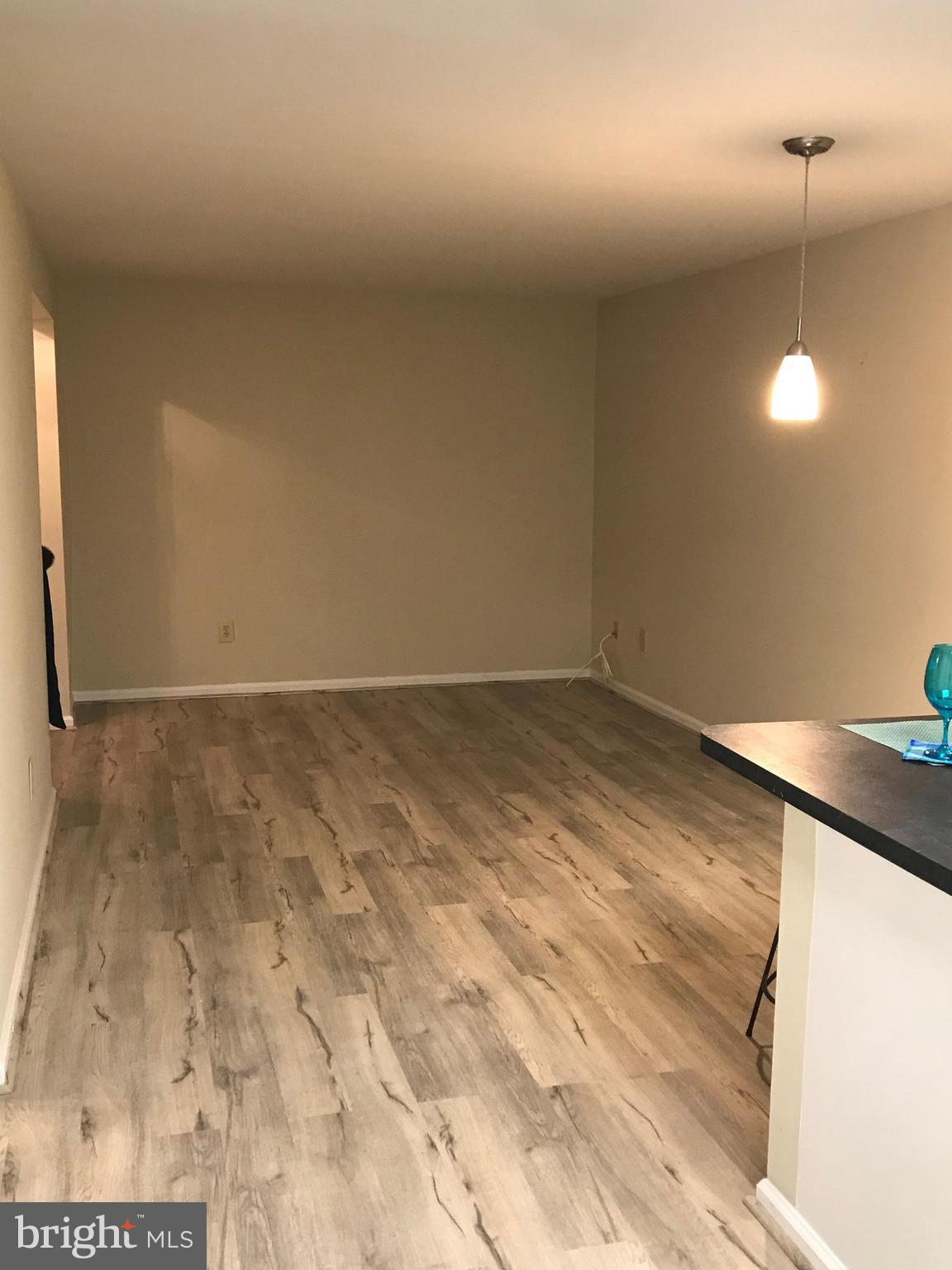 10712 Kings Riding Way, Unit T115 Rockville, MD 20852 - Photo 12 of 27 Living Room with beautiful new floors!