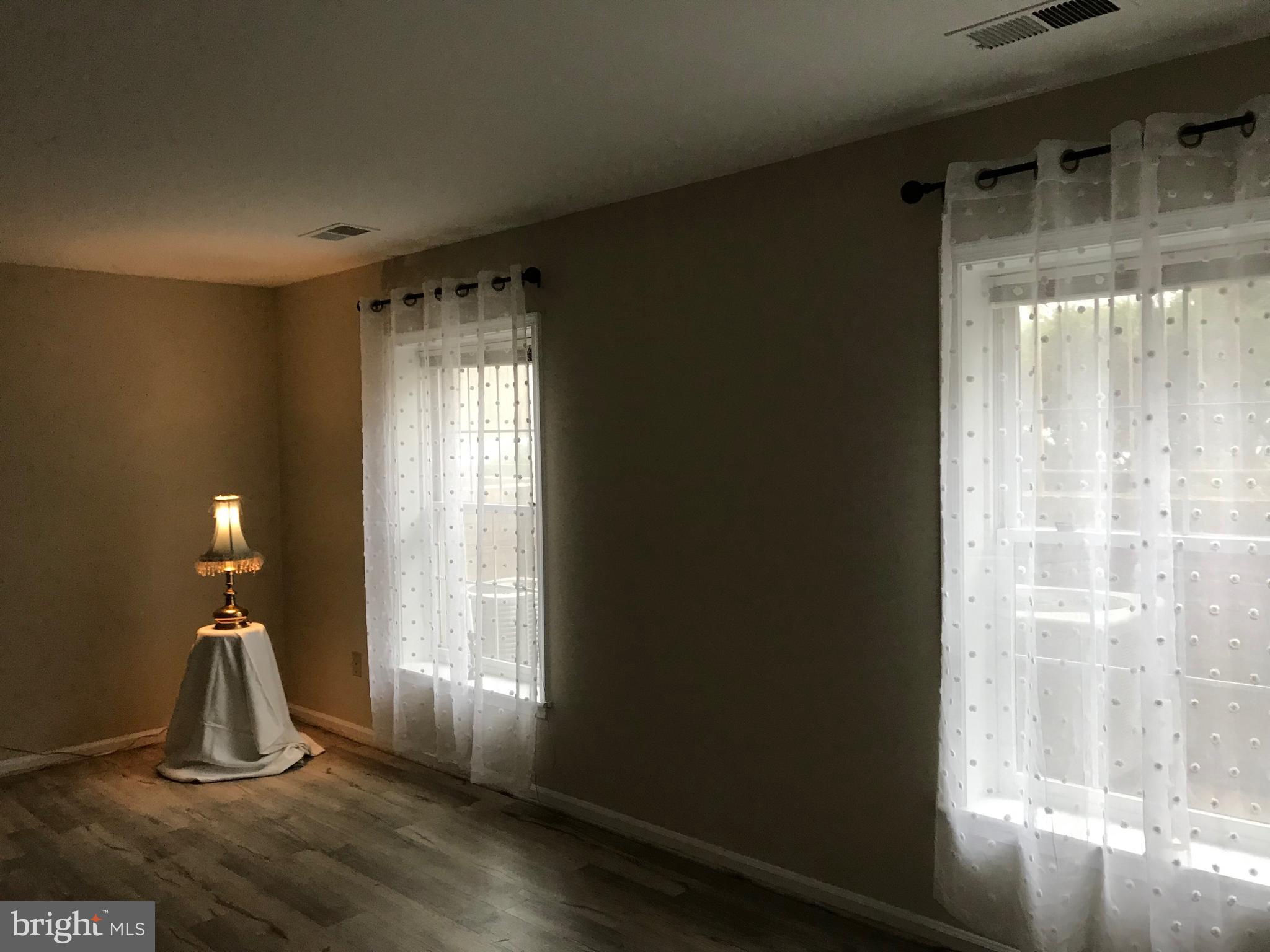 10712 Kings Riding Way, Unit T115 Rockville, MD 20852 - Photo 18 of 27 Bedroom with new floors & rods & curtains.