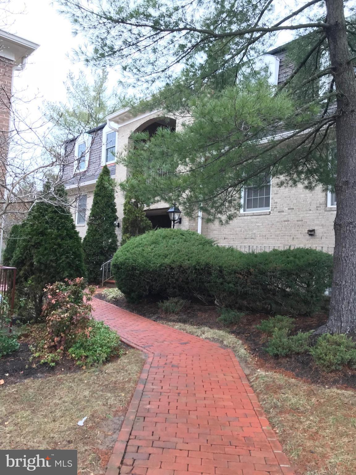 10712 Kings Riding Way, Unit T115 Rockville, MD 20852 - Photo 4 of 27 A nice meandering brick path to your home.