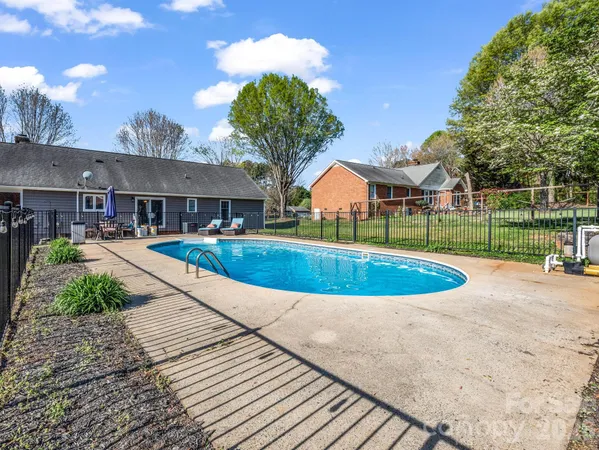 a view of a house with a swimming pool