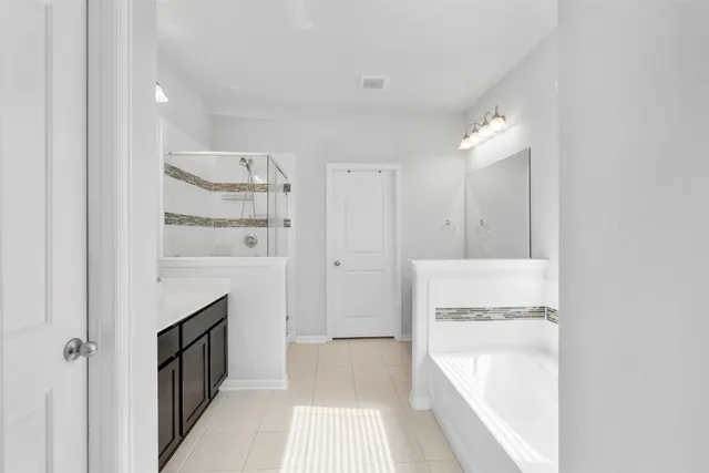 a living room with furniture and a ceiling fan