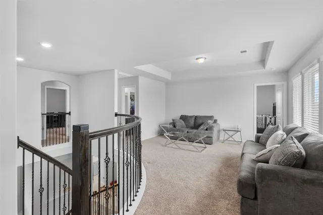 a living room with a couch and a window