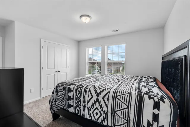 a spacious bathroom with a sink and a mirror