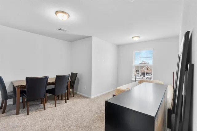 a bathroom with a sink mirror and toilet