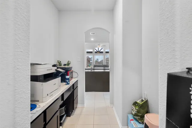 a bedroom with a bed and a large mirror