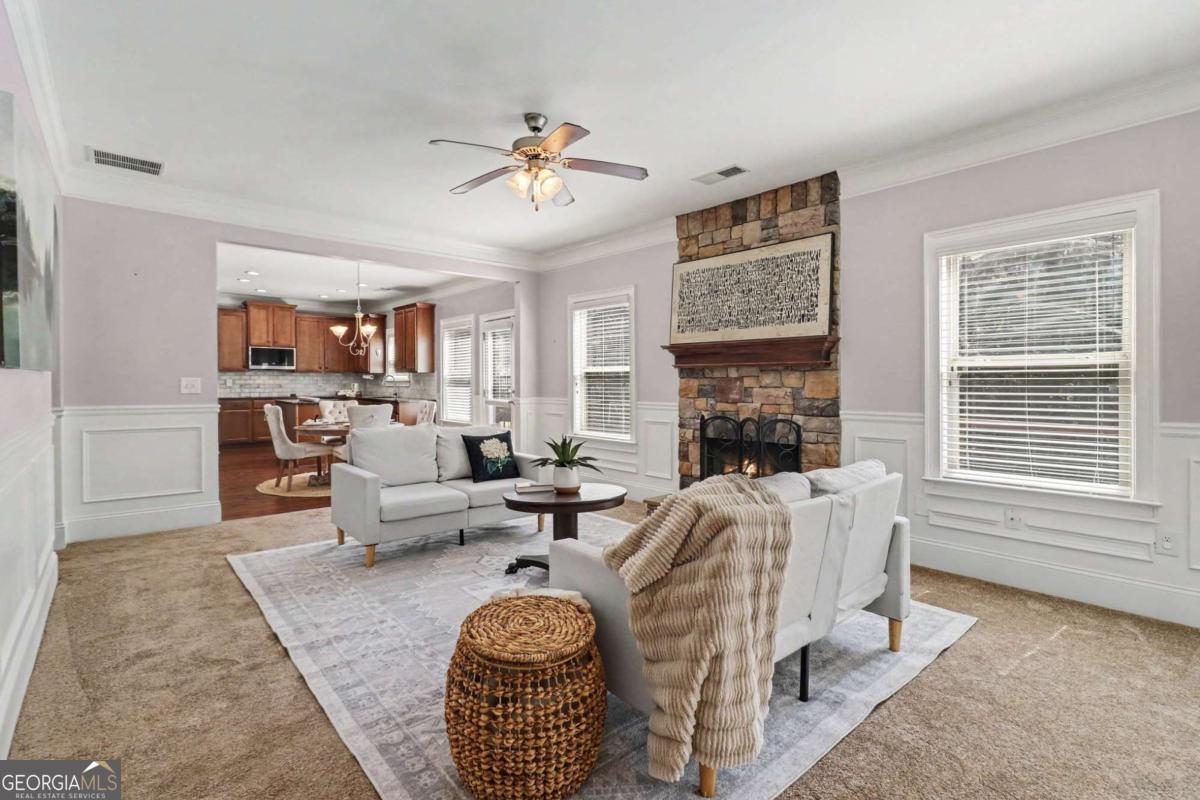 207 George Wynn Road Palmetto, GA 30268 - Photo 7 of 32 a living room with furniture and a fireplace