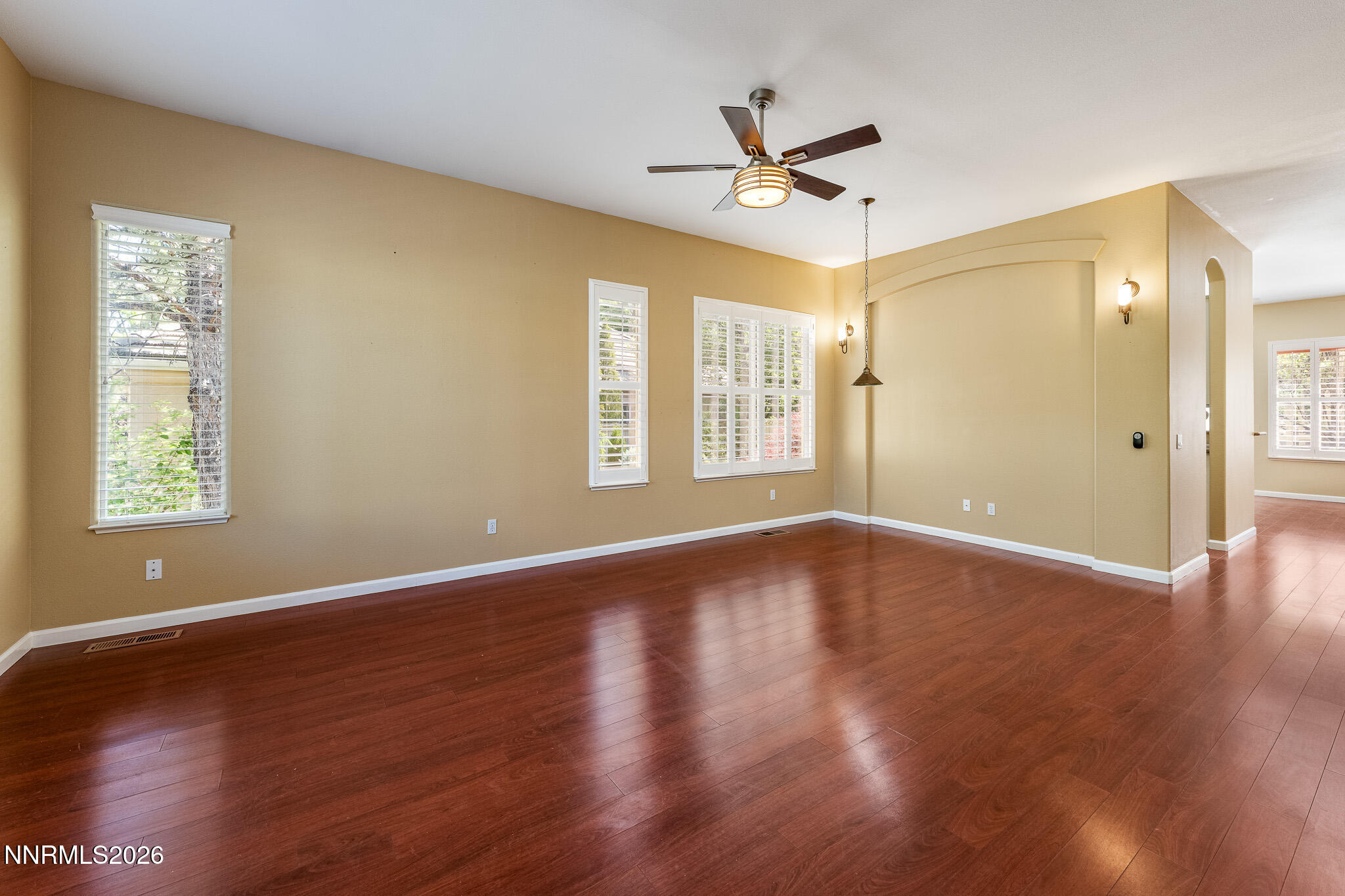 1840 Hunter Creek Road Reno, NV 89519 - Photo 11 of 39 a view of an empty room with wooden floor and a window
