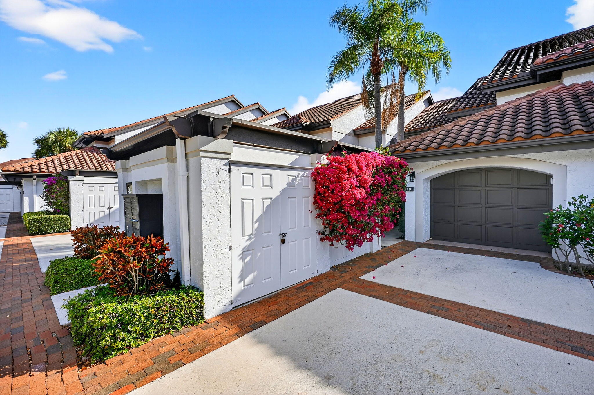 front view of a house with a potted plant