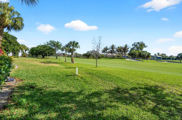 a view of a golf course with a lake