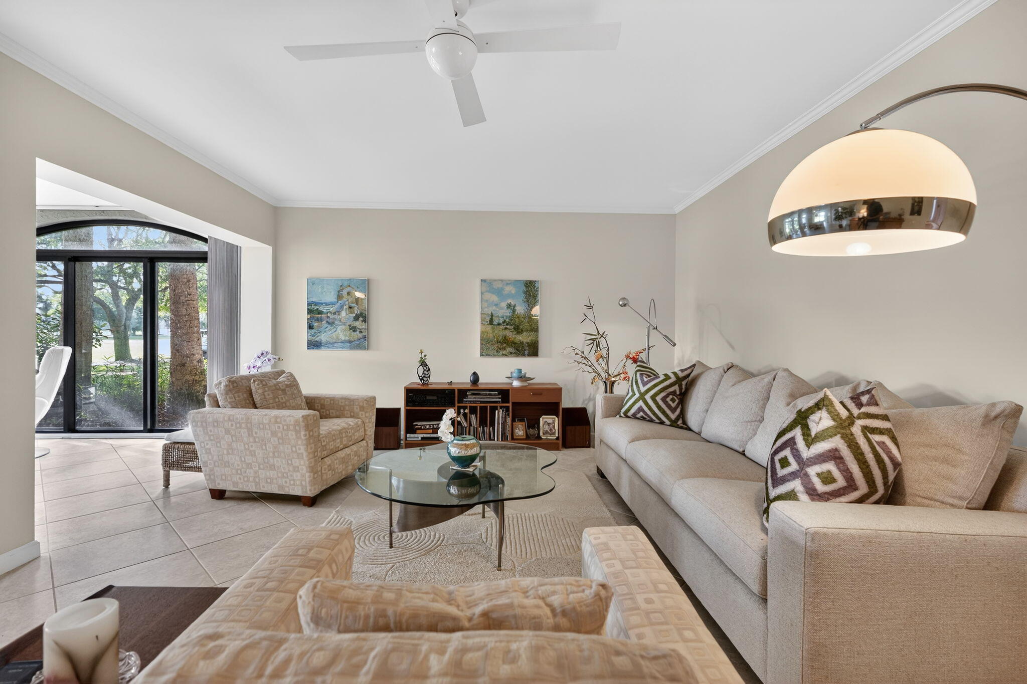 16670 Traders Crossing North, Unit 110 Jupiter, FL 33477 - Photo 6 of 22 a living room with furniture and a large window