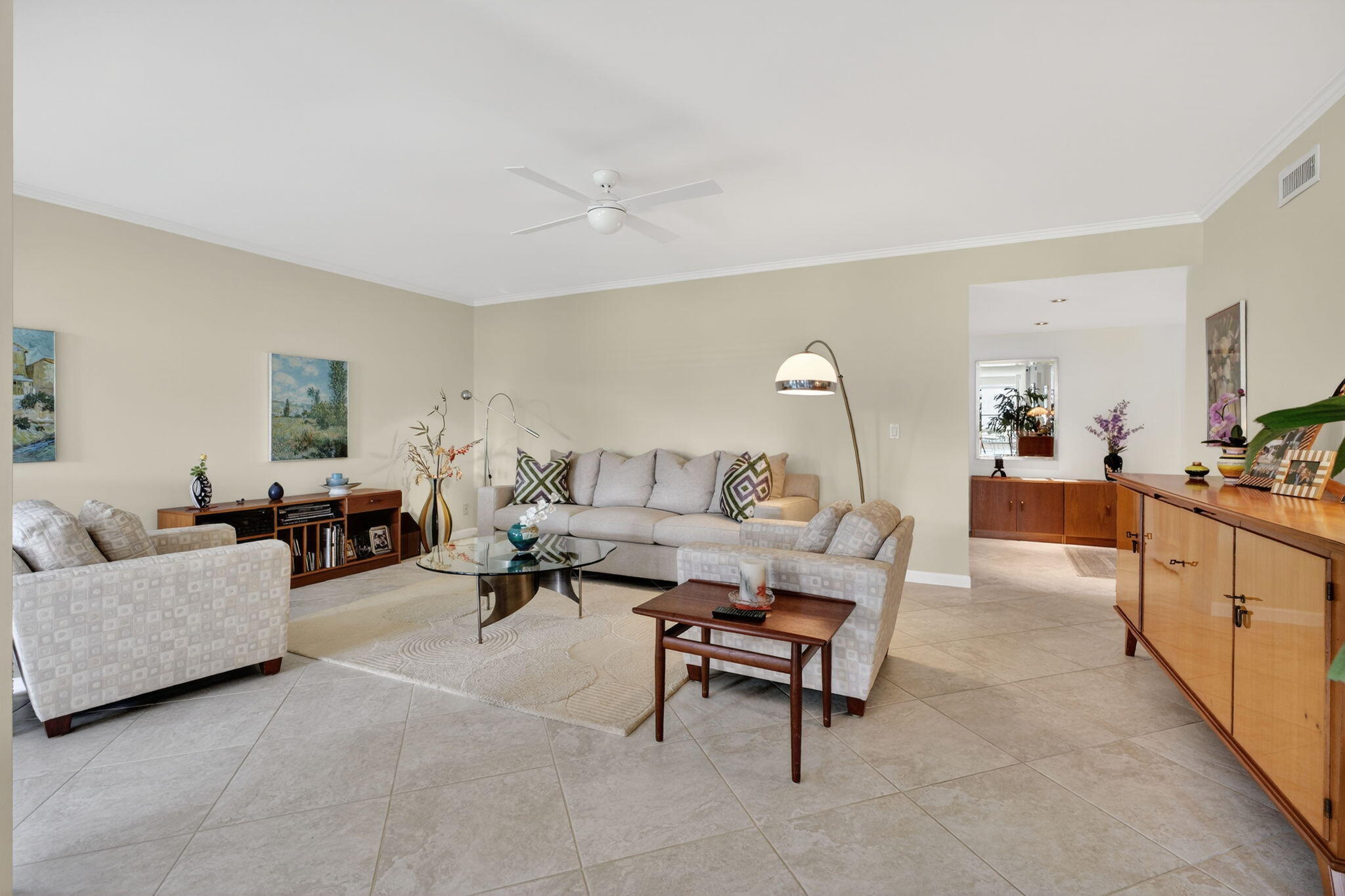 16670 Traders Crossing North, Unit 110 Jupiter, FL 33477 - Photo 7 of 22 a living room with furniture and a chandelier