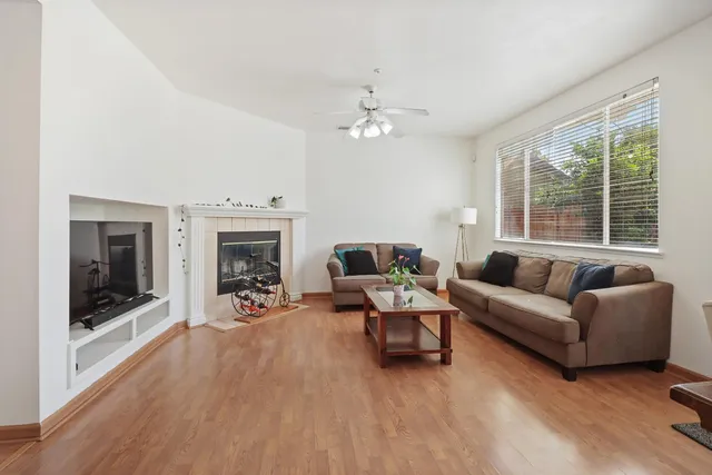 a living room with furniture and a fireplace