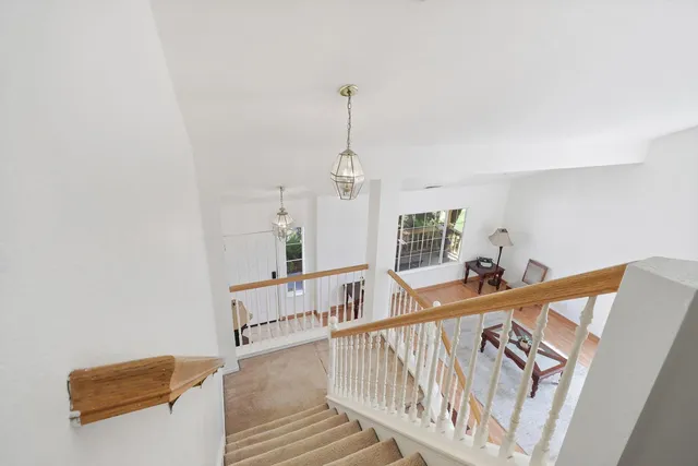 a view of a hallway with staircase