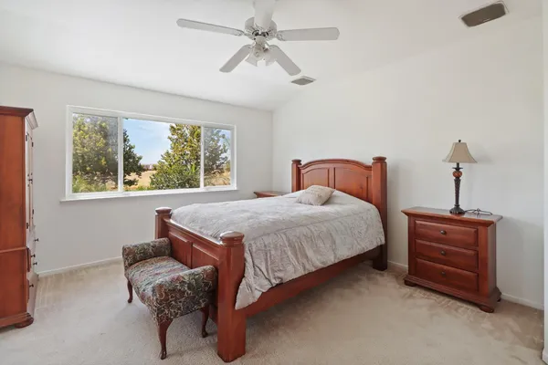 a bedroom with bed and window
