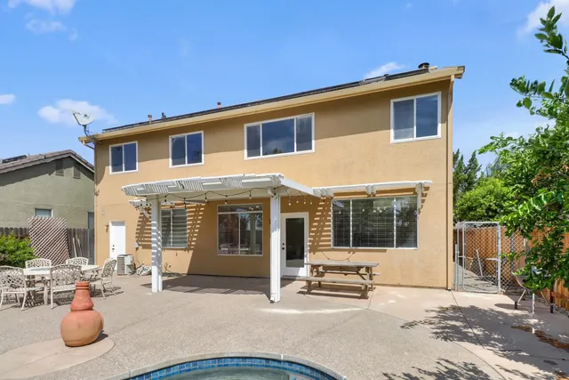 a backyard of a house with seating space
