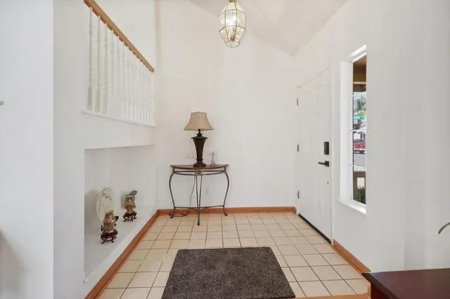 a view of a hallway with seating area