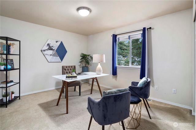 a view of a workspace with furniture