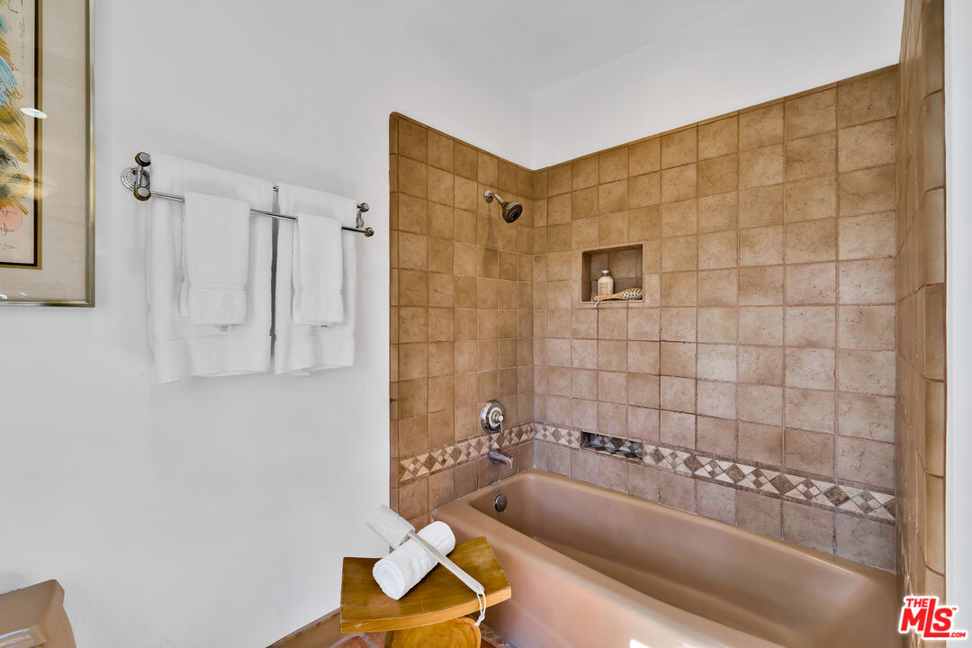 73589 Haystack Road Palm Desert, CA 92260 - Photo 20 of 54 a bathroom with a tub and a shower