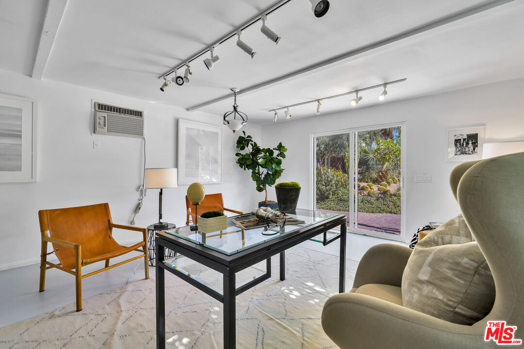 73589 Haystack Road Palm Desert, CA 92260 - Photo 26 of 54 a living room with furniture and a window