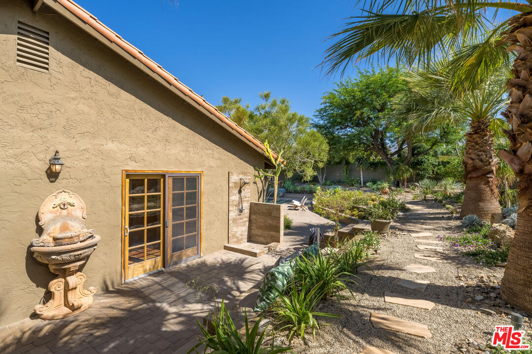 73589 Haystack Road Palm Desert, CA 92260 - Photo 36 of 54 a front view of a house with a yard
