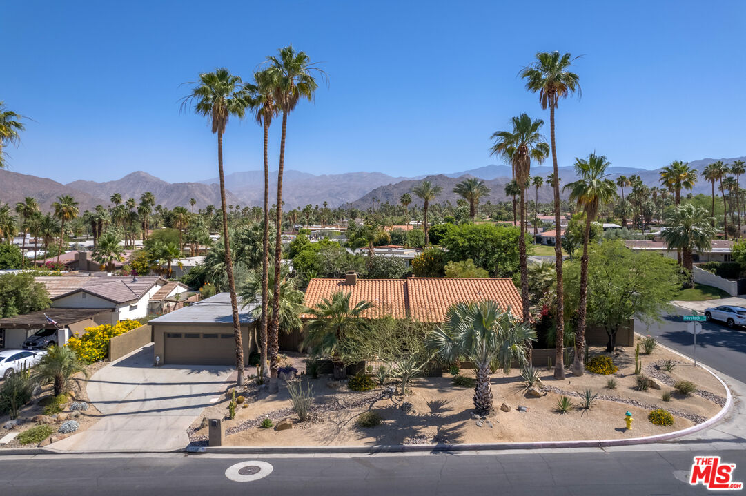 73589 Haystack Road Palm Desert, CA 92260 - Photo 47 of 54 a view of a swimming pool with a table and chairs