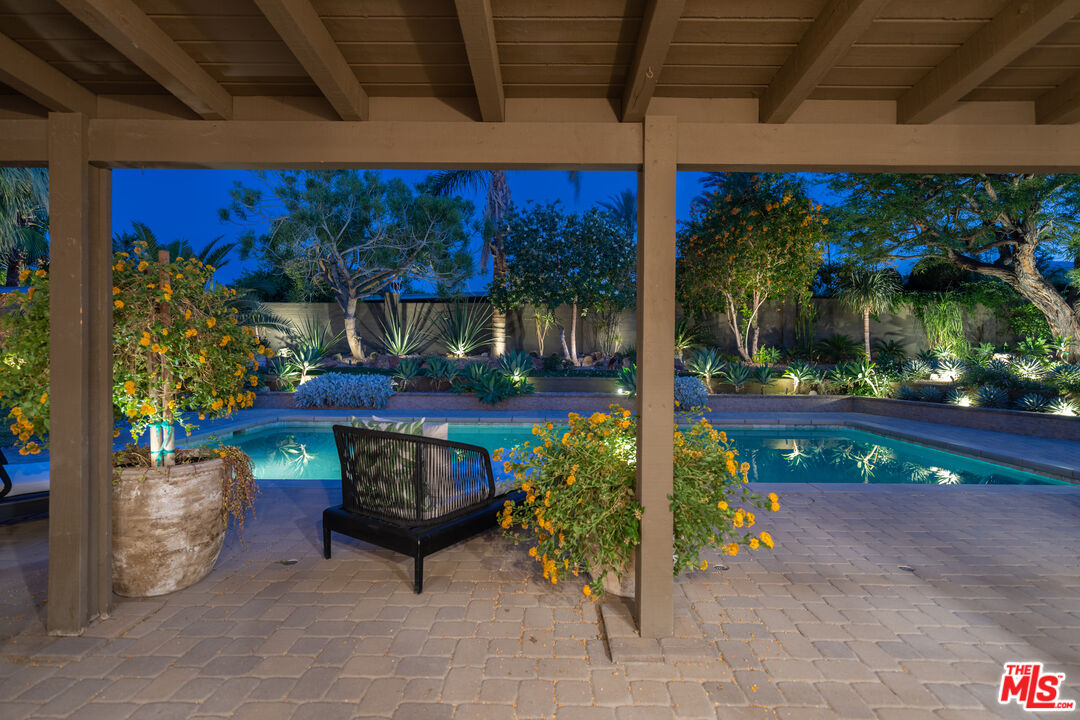 73589 Haystack Road Palm Desert, CA 92260 - Photo 48 of 54 a view of a patio with table and chairs potted plants
