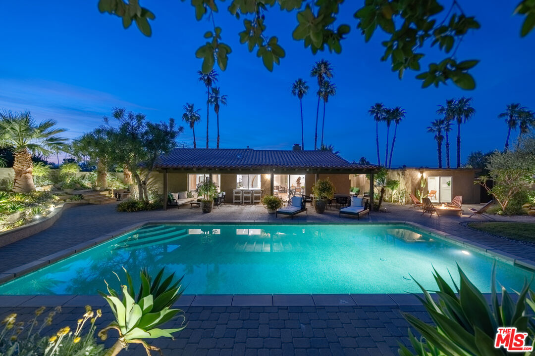 73589 Haystack Road Palm Desert, CA 92260 - Photo 51 of 54 a view of a swimming pool with an outdoor seating