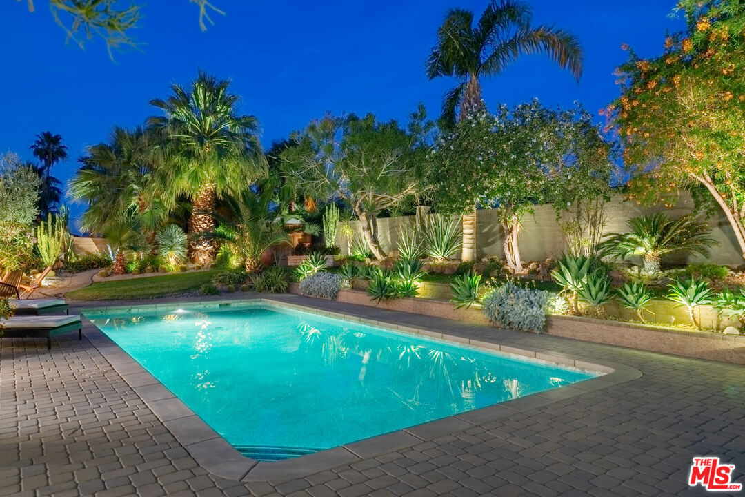 73589 Haystack Road Palm Desert, CA 92260 - Photo 53 of 54 a view of a swimming pool with an outdoor space and seating area