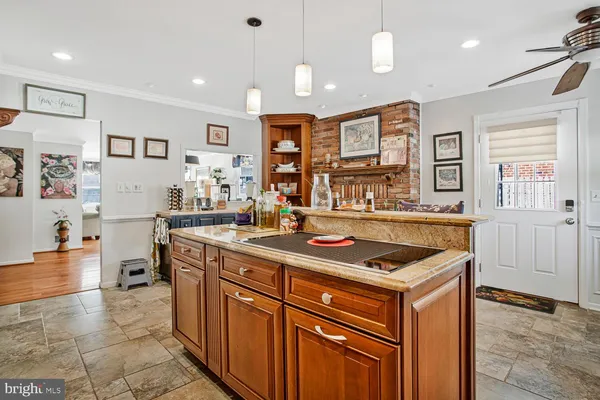 a kitchen that has a lot of cabinets in it