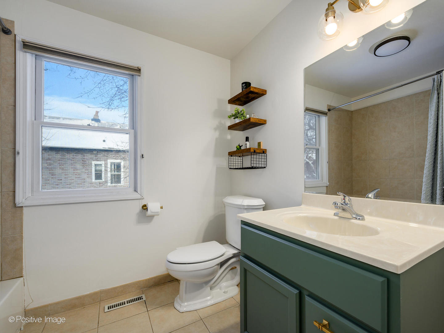1720 West Altgeld Street Chicago, IL 60614 - Photo 10 of 11 a bathroom with a sink toilet and vanity