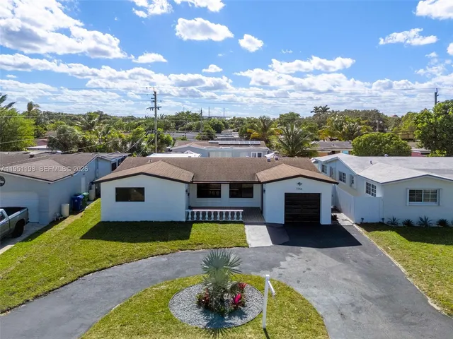 a aerial view of a house with a garden