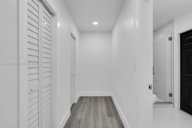 a view of hallway with walk in closet