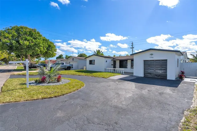 a view of a house with a swimming pool