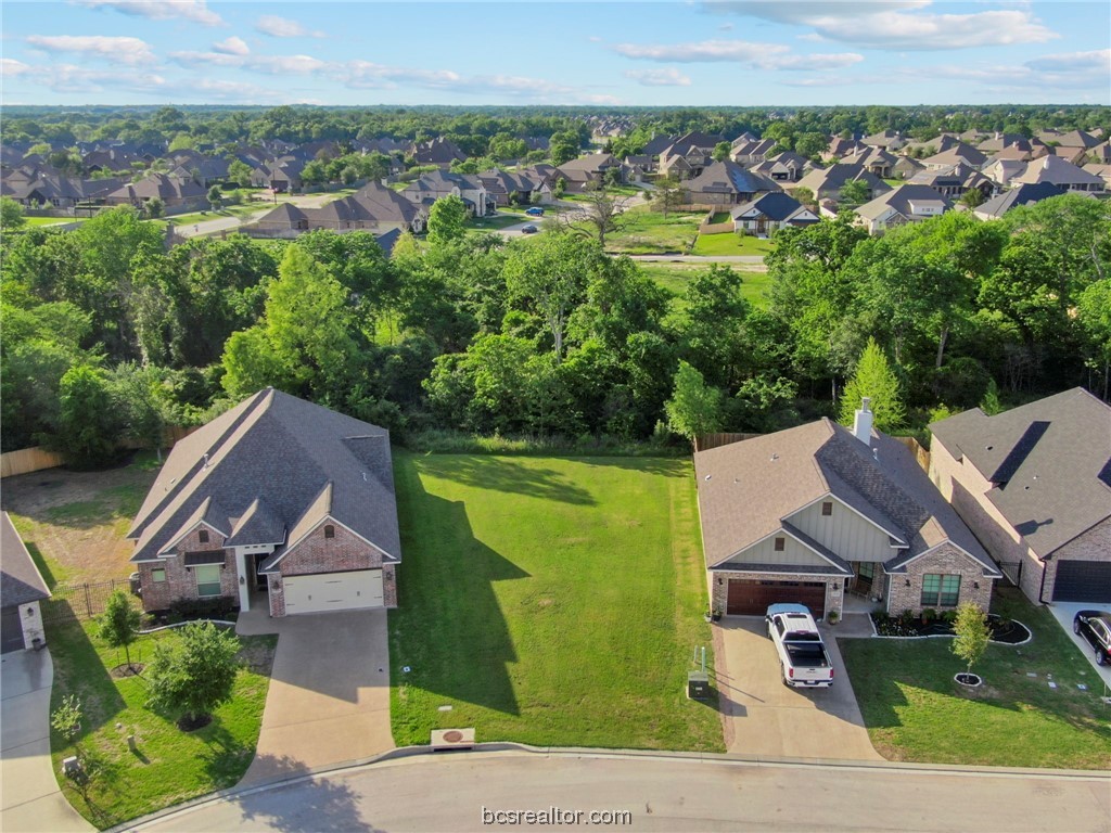 an aerial view of a house with a garden