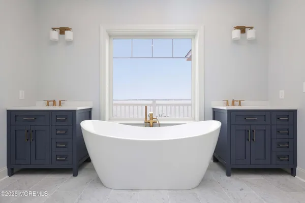 a white bath tub sitting in a bathroom