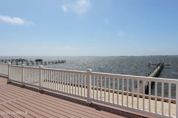 a view of a balcony with wooden floor