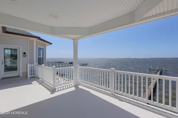 a view of a balcony with furniture