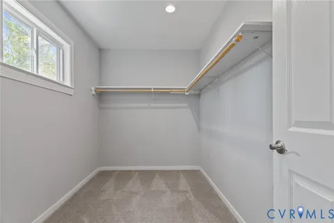 a bathroom with double sink and a toilet