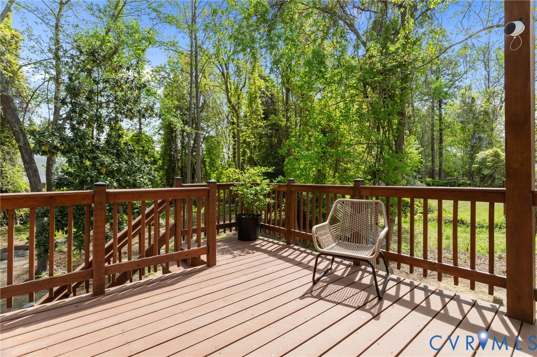 2701 Perdue Avenue Chester, VA 23831 - Photo 36 of 54 a balcony with wooden floor and outdoor seating