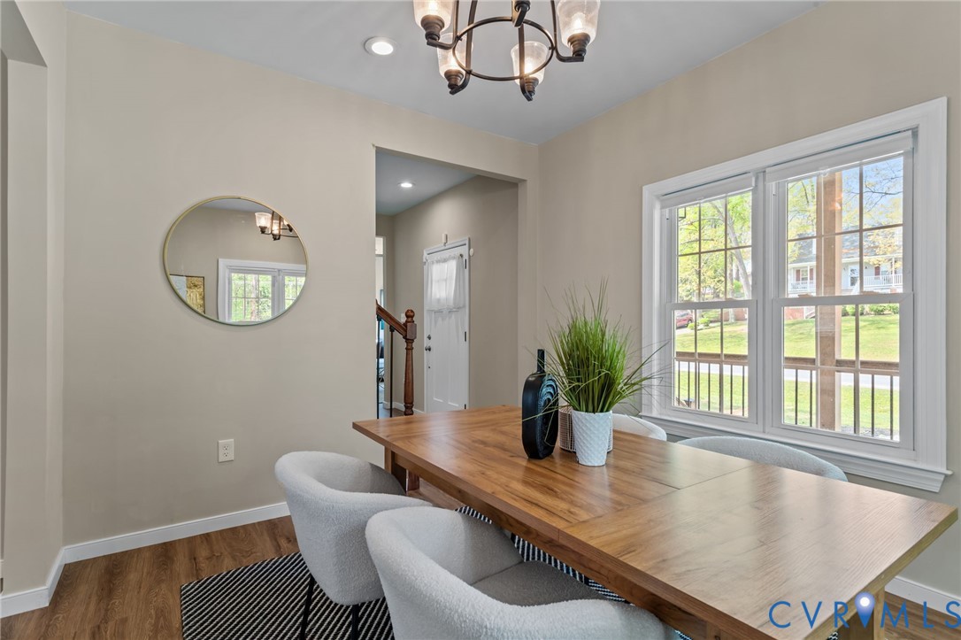 2701 Perdue Avenue Chester, VA 23831 - Photo 10 of 54 a view of a dining room with furniture a chandelier and wooden floor
