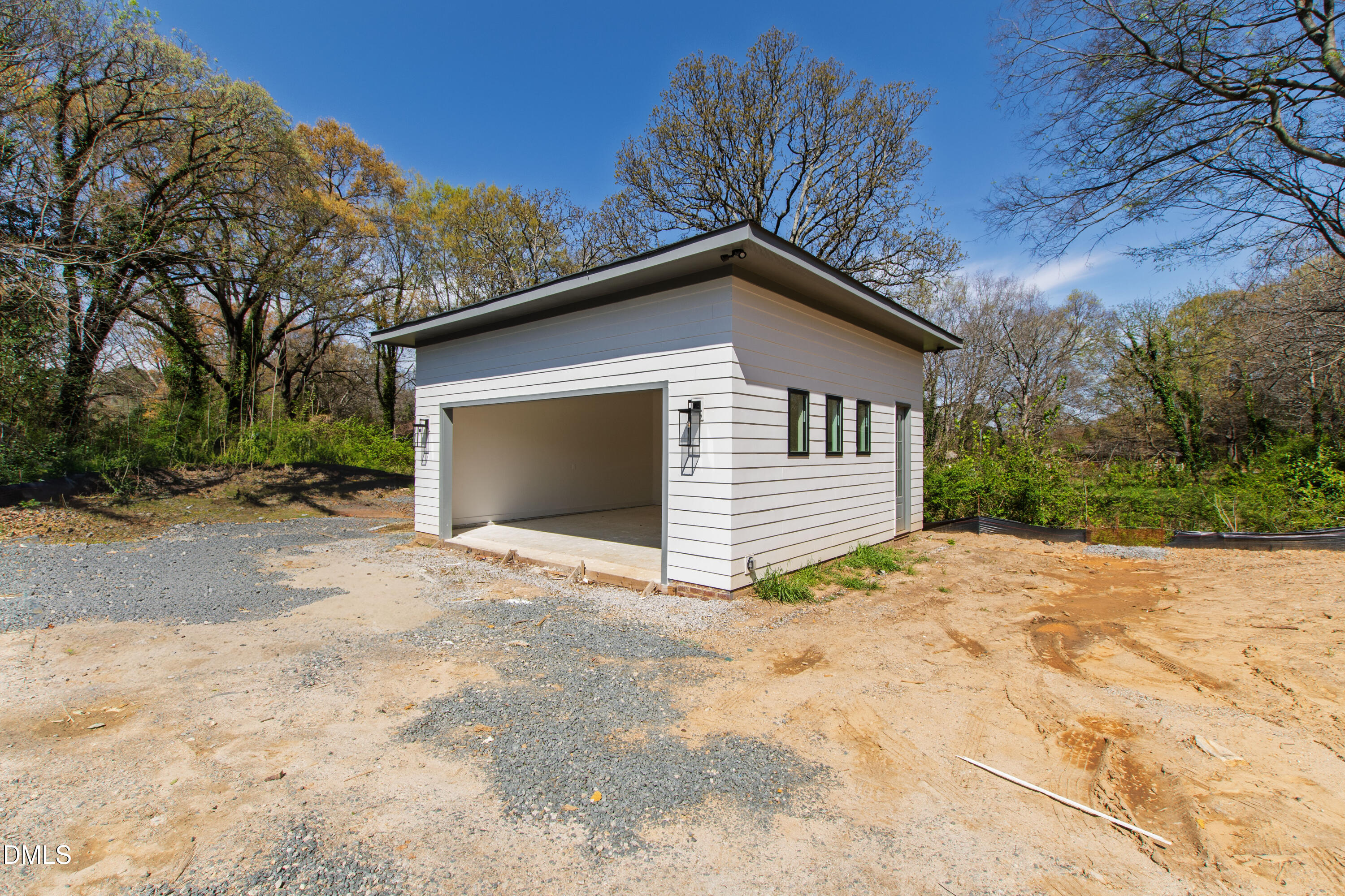 909 Oberlin Road Raleigh, NC 27605 - Photo 48 of 59 a view of a house with a yard and garage