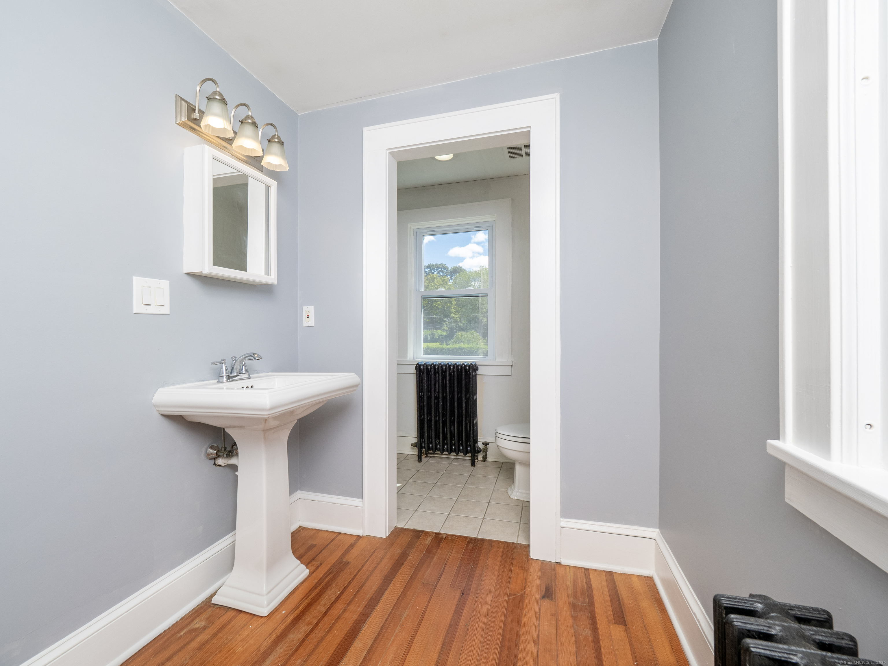 159 Barry Avenue Ridgefield, CT 06877 - Photo 21 of 39 a bathroom with a sink and a mirror