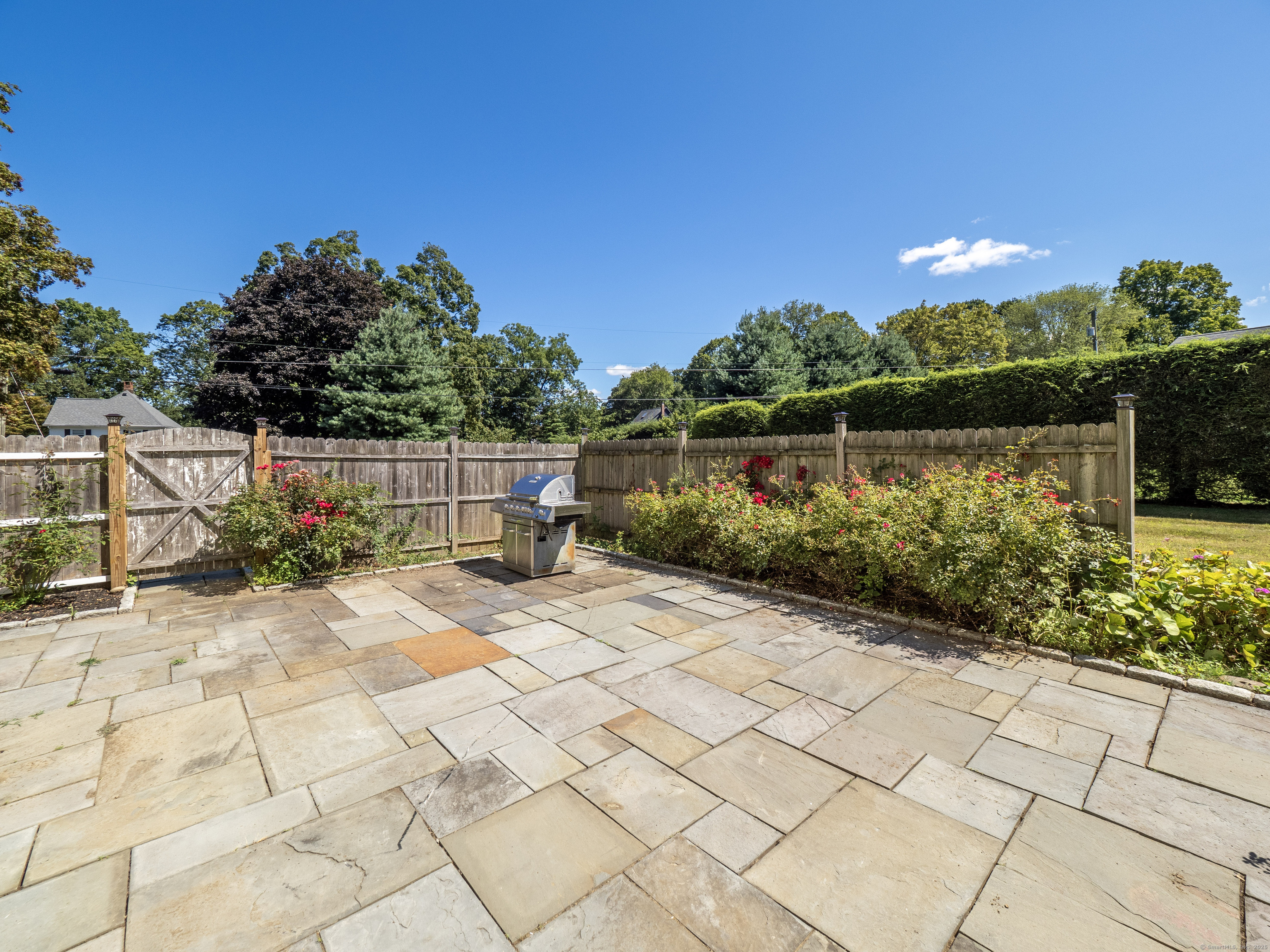 159 Barry Avenue Ridgefield, CT 06877 - Photo 24 of 39 a view of a pathway with a wrought fence